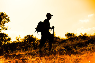 that climbers trekking at sunset