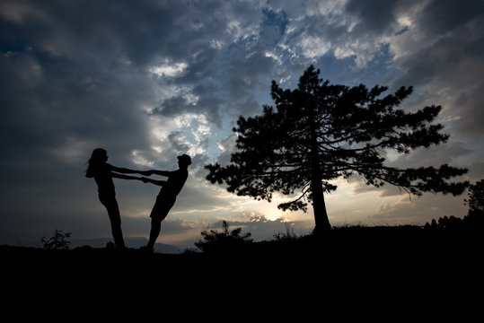 silhouette of young couples
