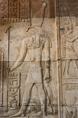 Hieroglyphic carvings on the exterior walls of  egyptian temple