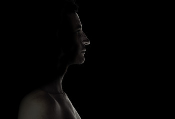man in dark studio closeup black and white - 119745582
