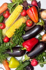 Fresh vegetables and greens on the kitchen table