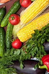 Fresh vegetables and greens on the kitchen table