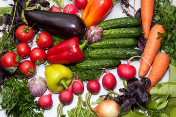 Fresh vegetables and greens on the kitchen table