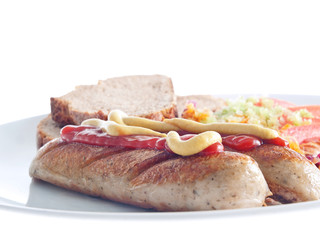 tofu sausage with vegetable salad and bread
