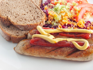 tofu sausage with ketchup, mustard,  vegetable salad and bread