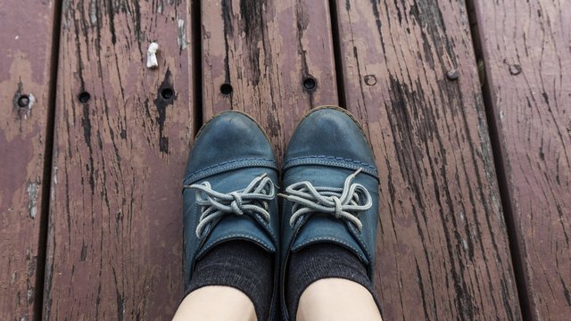 blue boots fashion on old wooden floor background.