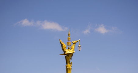 Fototapeta na wymiar Golden swan or Lantern hanger statue in Thailand. Traditional style lighting lamp of Thai.