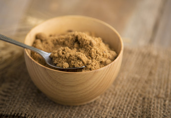 coconut palm sugar against an out of focus