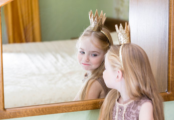 princess little girl painting makeup lipstick on mirror © SharlottaU