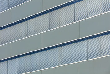 Windows of an office building with closed shutters