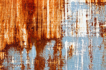 A background of peeling paint and rusty old metal