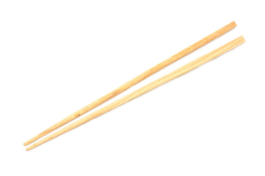 Wooden chopsticks on white background.