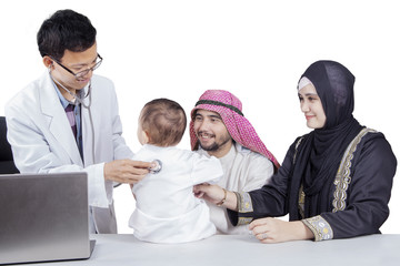 Fototapeta na wymiar Arabic family visiting doctor