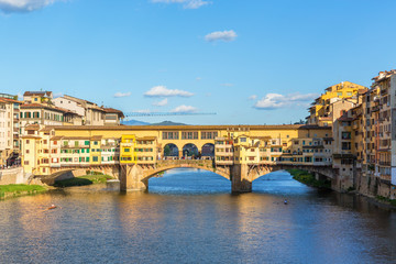 Fototapeta na wymiar Ponte Vecchio bridge with canoes on the River Arno in Florence
