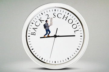 Male student walks on the clock