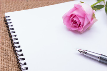 Diary note with rose on gunny bag (Organizer ,agenda, book, diar