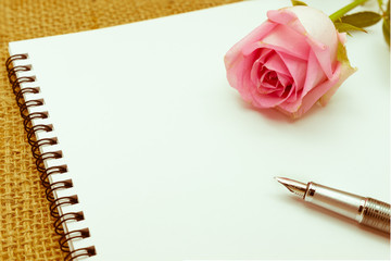 Diary note with rose on gunny bag (Organizer ,agenda, book, diar