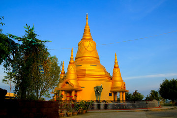 temple with gold pagoda in Battambang, Cambodia.