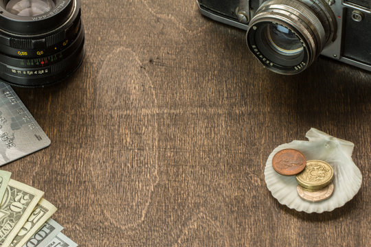 Wooden Desktop of aTraveler Preparing for a Trip