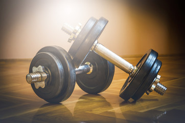 Obraz na płótnie Canvas Black gym barbell, dumbbell with disks