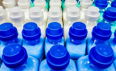 Color plastic bottles in a row.
