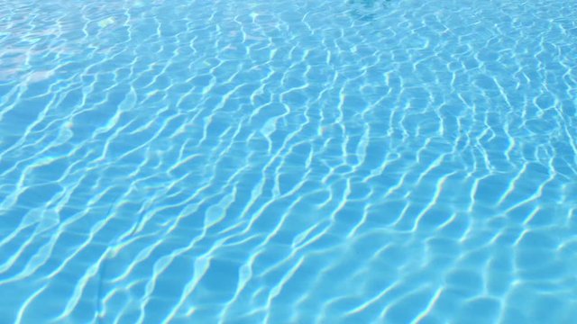 Water motion. Blue water in swimming pool