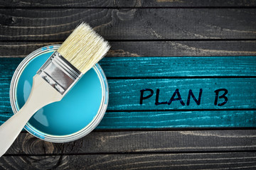 Plan B message and paintbrush on table