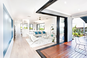 Luxury living room and wooden hallway beside a patio