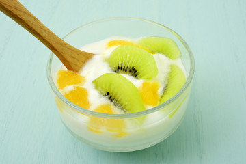 Fresh yogurt with orange and kiwi