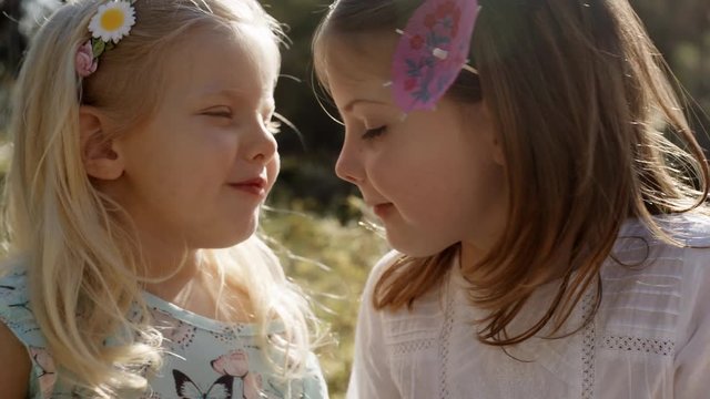 Two children touching noses