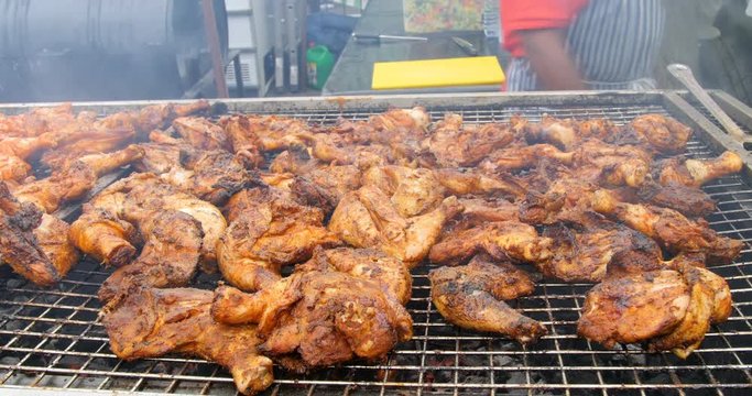 Jamaican jerk chicken barbeque on charcoal grill