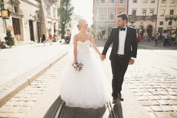 Luxury married wedding couple, bride and groom posing in old city