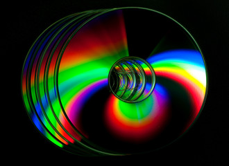 CD and DVD disk on black background