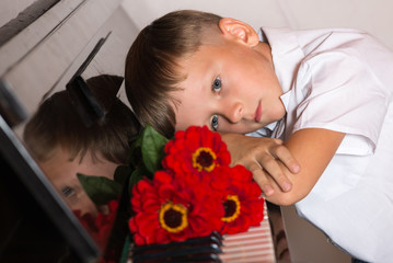 pianist boy with a bouquet of flowers