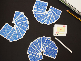 Playing Cards, card suit.Blue deck of playing cards over black background 