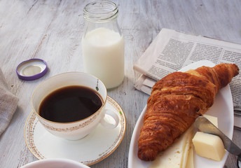 Cup of coffee espresso with croissant