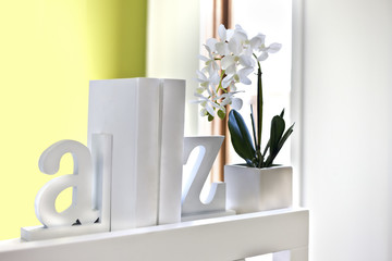 House interior decoration using 3d letters and flowering plant