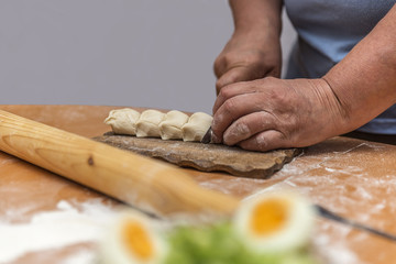 process of rolling out the dough for making pastry