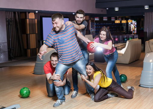 Friends having fun in bowling