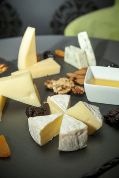different types of cheeses with dried fruits