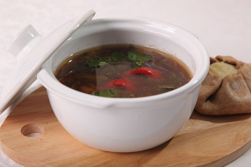 mushroom soup on a wooden cutting board