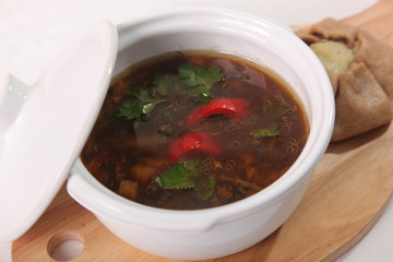 mushroom soup on a wooden cutting board