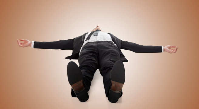 Businessman Lying On Ground