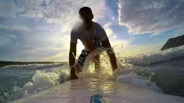 surfing in slow motion at sunset