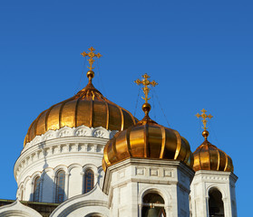 Golden crosses and blue skies