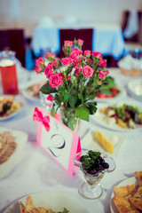 Beautiful wedding day ceremony set up. Indoor. Good served table in a restaurant.