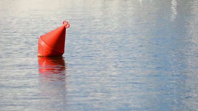 red buoy on the water
