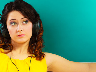 girl in big headphones listening music mp3 relaxing