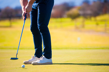 view of a golfer planning his shot to the pin