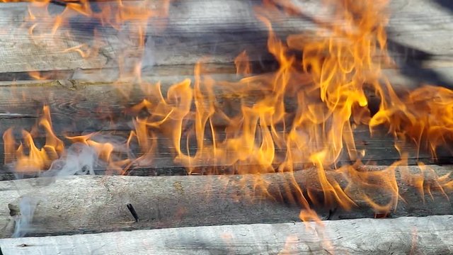 House wooden wall on fire